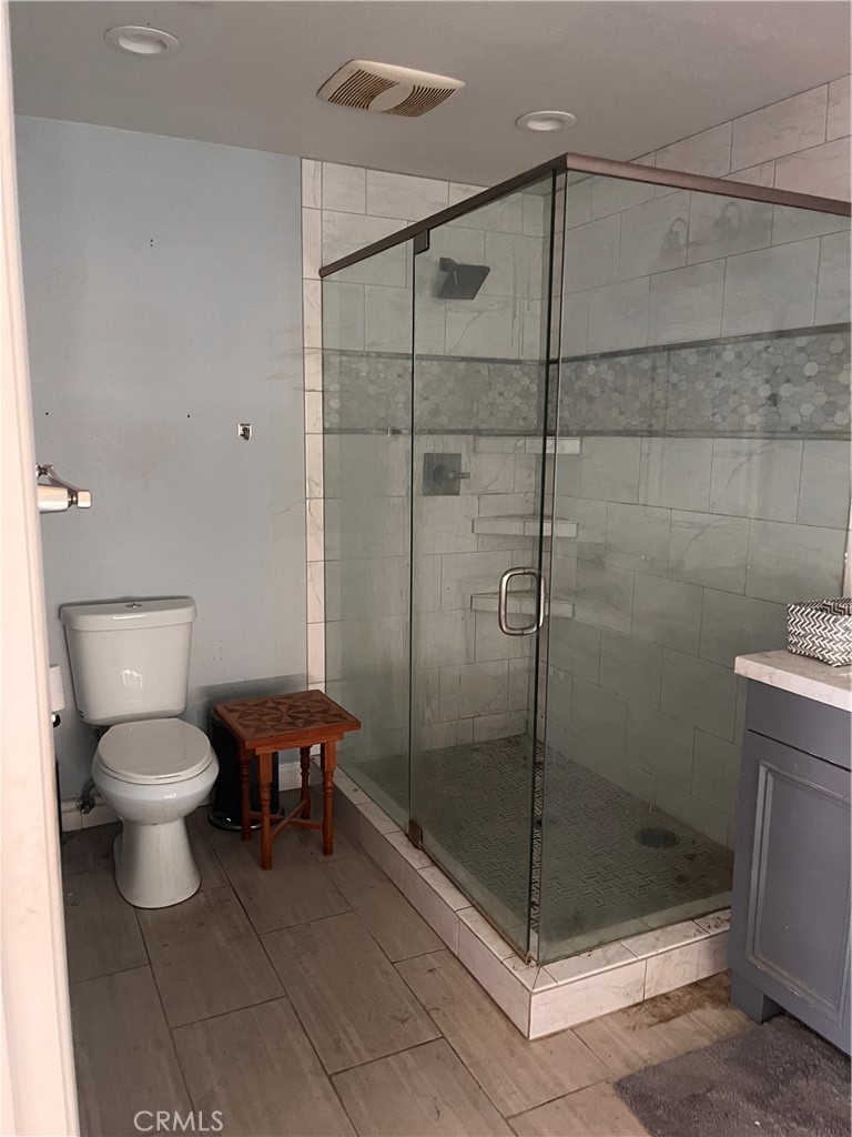 24638 Pappas Road Ramona, CA 92065 - Photo 2 of 23 a bathroom with a toilet and a shower