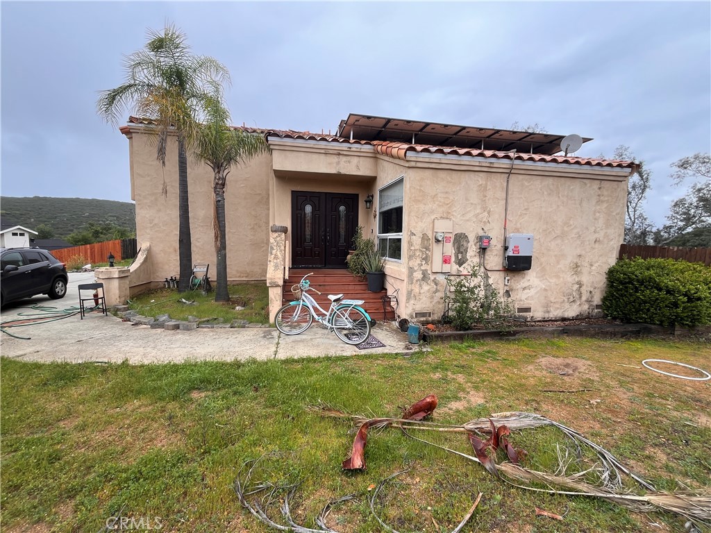 24638 Pappas Road Ramona, CA 92065 - Photo 21 of 23 a view of a patio with table and chairs potted plants