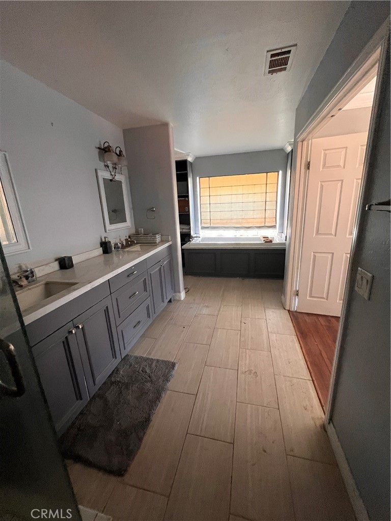 24638 Pappas Road Ramona, CA 92065 - Photo 4 of 23 a view of a kitchen with a sink dishwasher and a fireplace