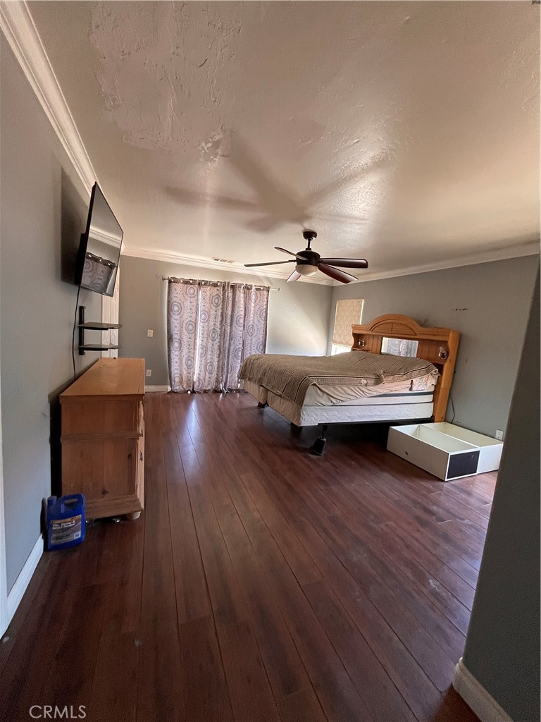 24638 Pappas Road Ramona, CA 92065 - Photo 6 of 23 a bedroom with furniture and a wooden floor