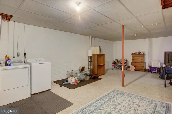 a room with furniture and a view of living room