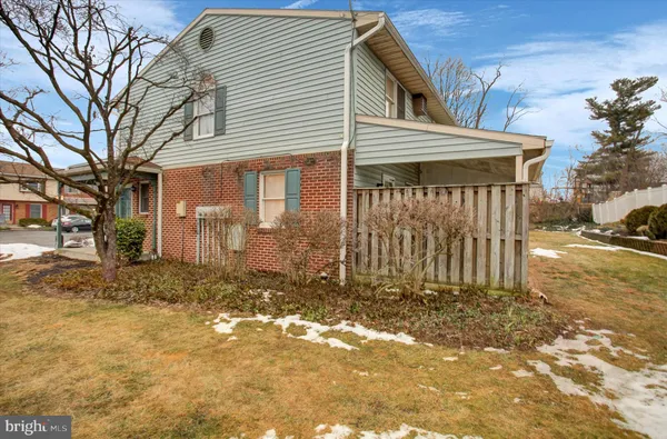 a house with trees in front of it