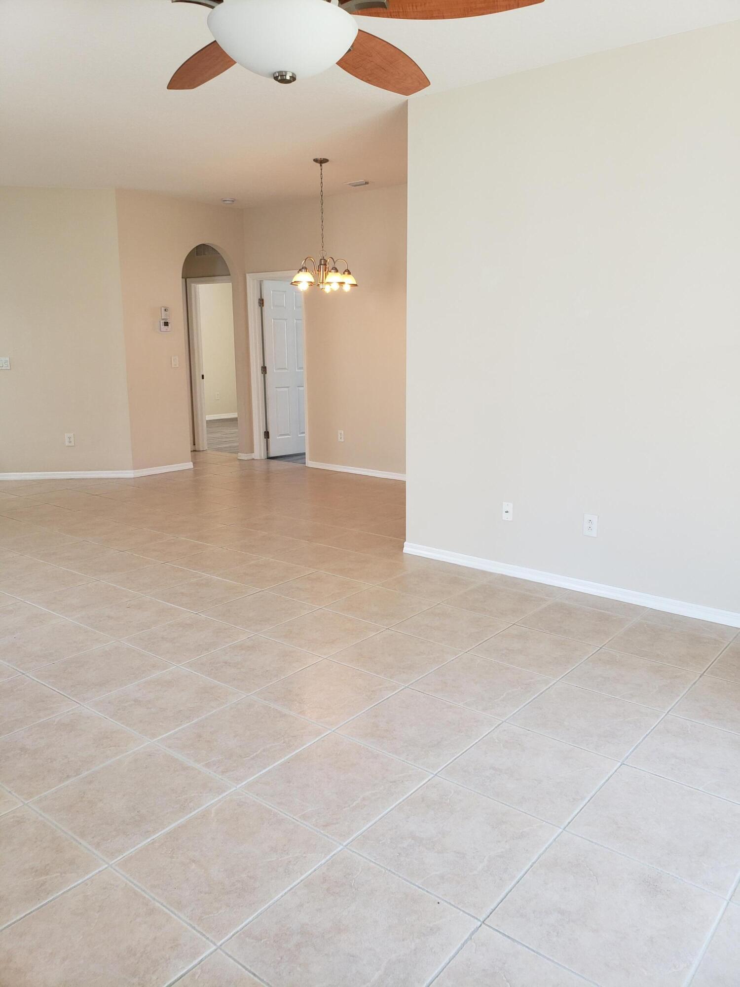 357 Southwest Coconut Key Way Port St. Lucie, FL 34986 - Photo 10 of 56 an empty room with a empty space and windows