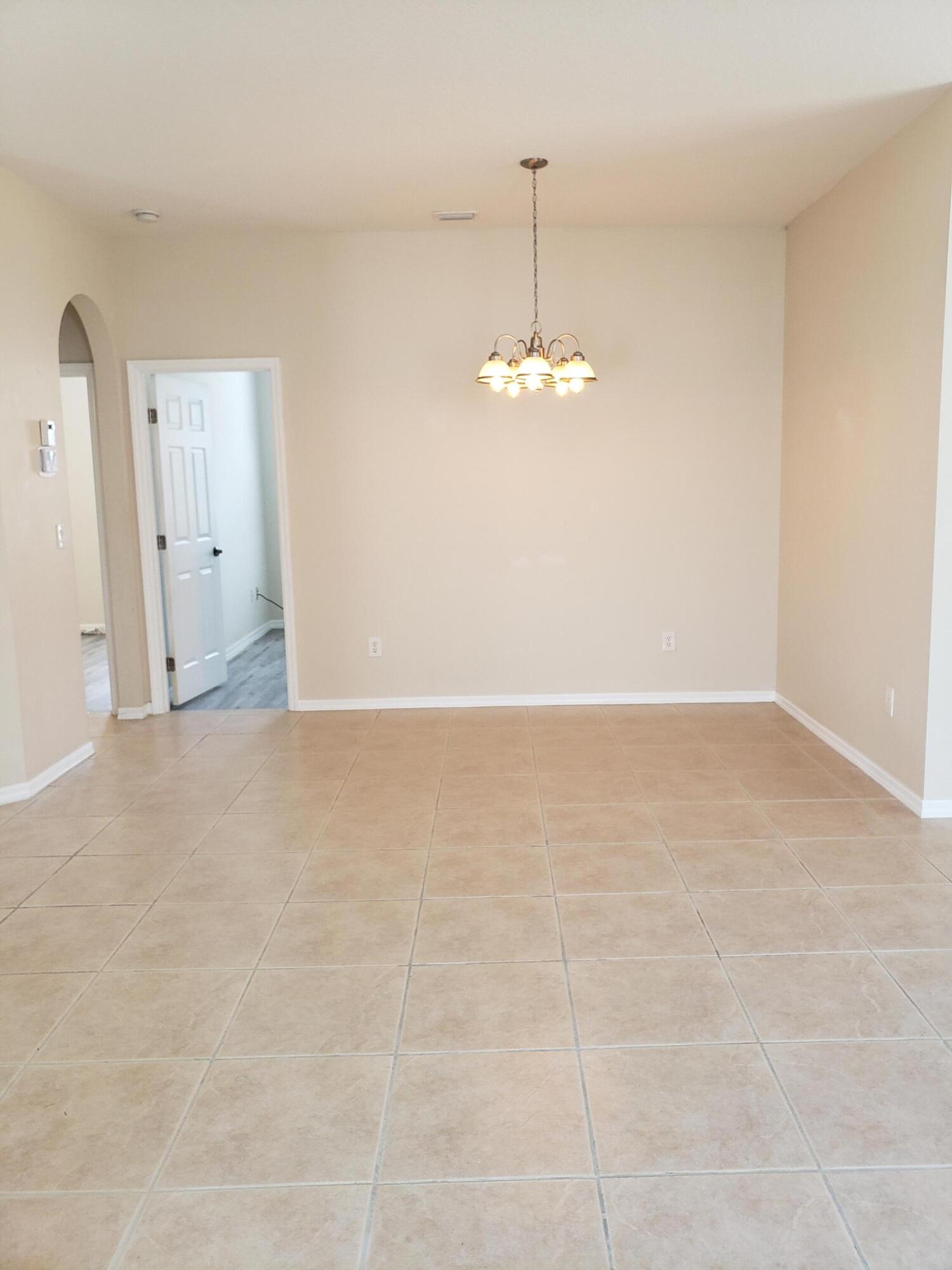 357 Southwest Coconut Key Way Port St. Lucie, FL 34986 - Photo 11 of 56 a view of an empty room with a window