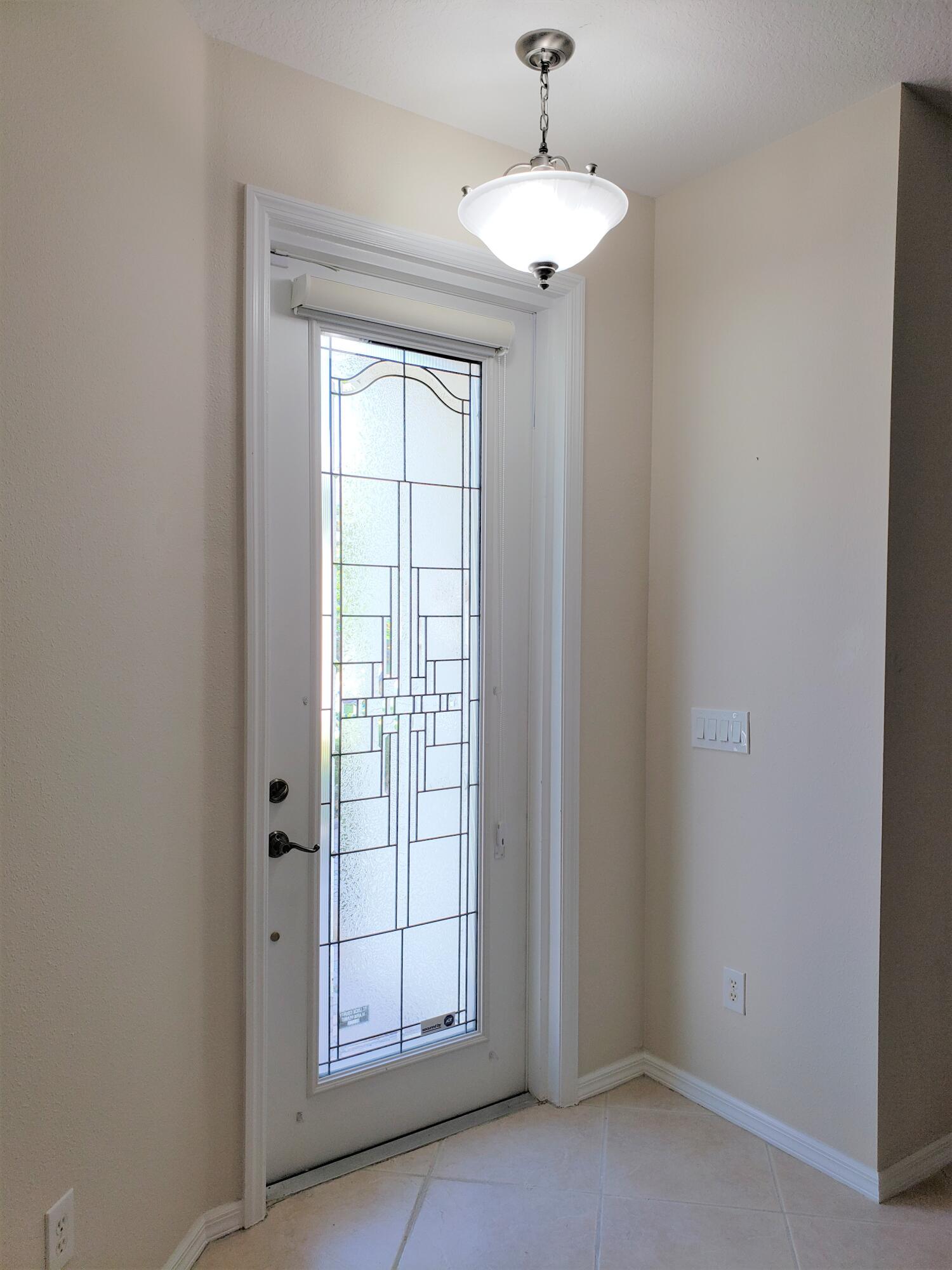 357 Southwest Coconut Key Way Port St. Lucie, FL 34986 - Photo 23 of 56 an empty room with windows