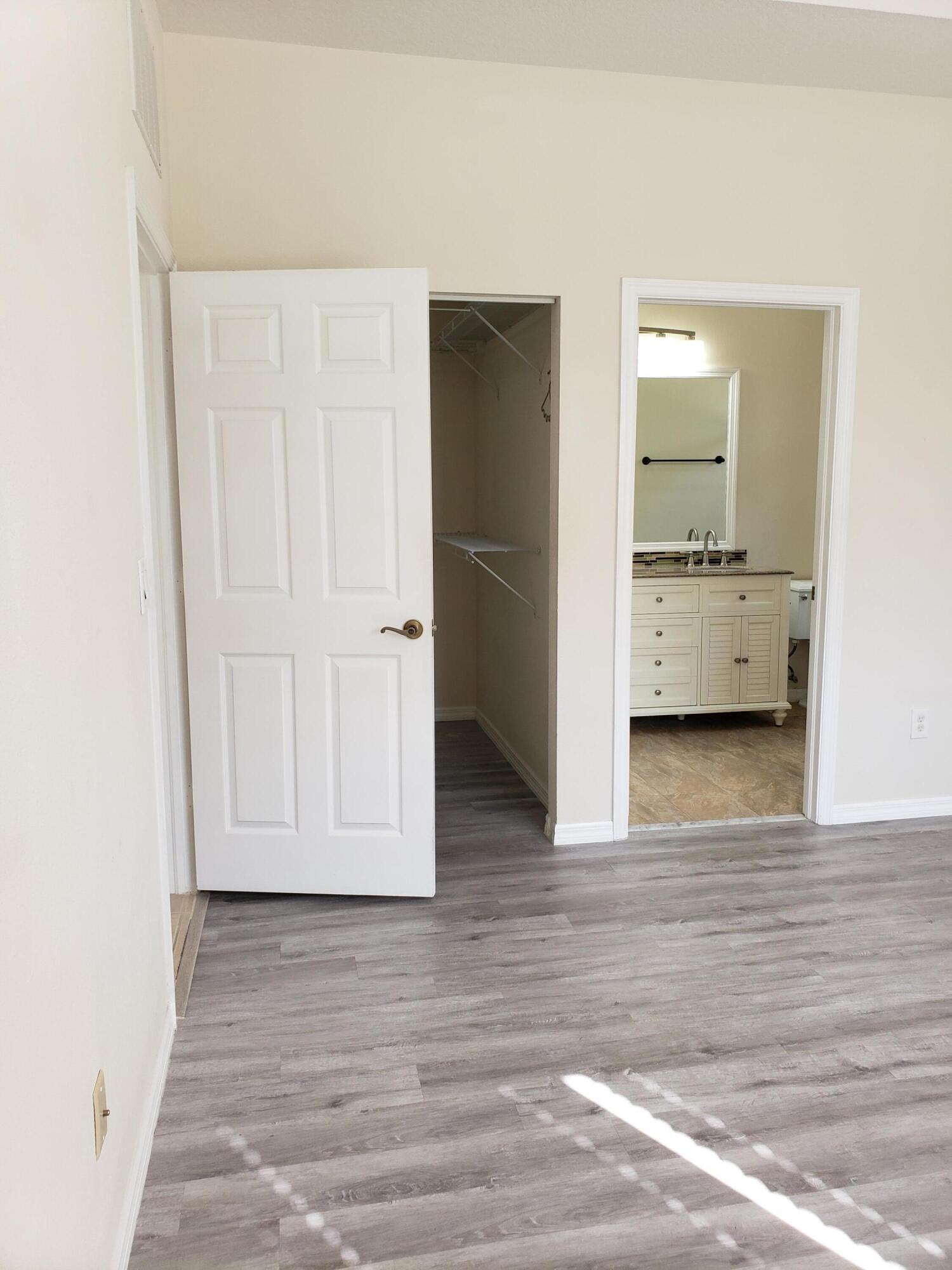 357 Southwest Coconut Key Way Port St. Lucie, FL 34986 - Photo 25 of 56 a view of room with furniture and wooden floor