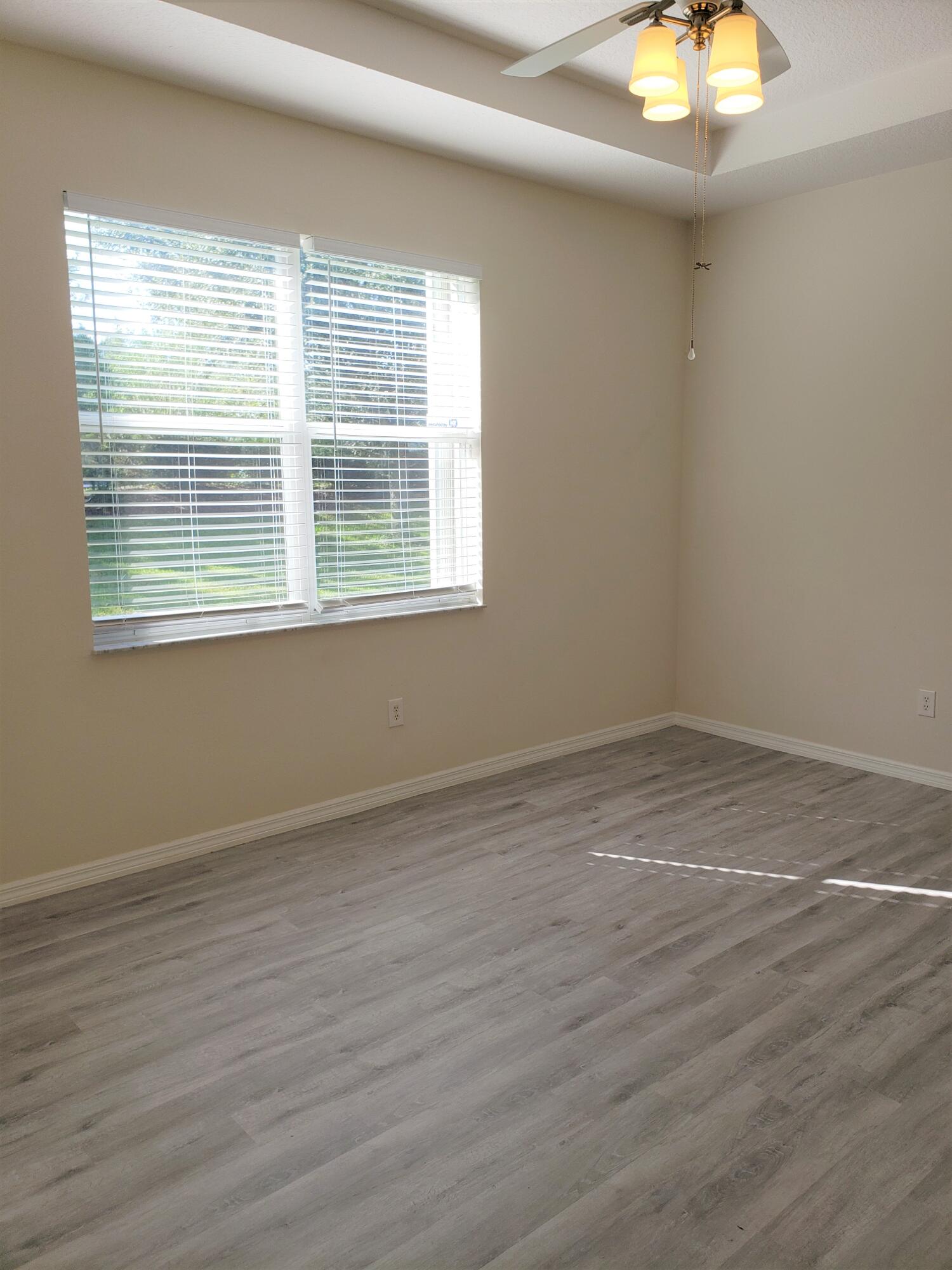 357 Southwest Coconut Key Way Port St. Lucie, FL 34986 - Photo 26 of 56 an empty room with a window