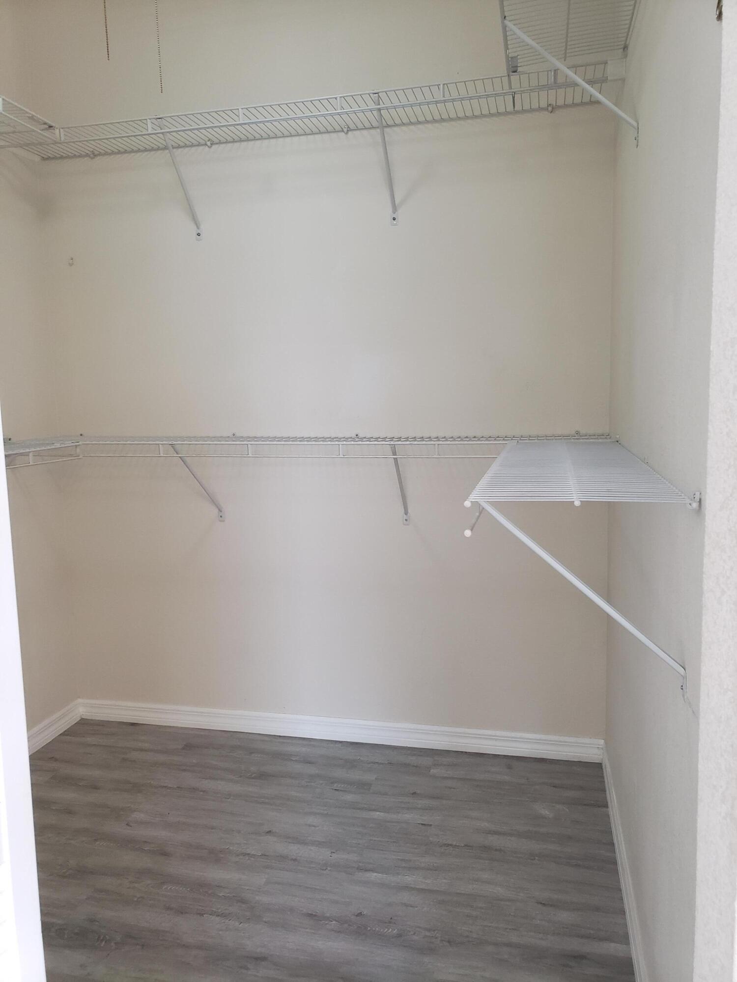 357 Southwest Coconut Key Way Port St. Lucie, FL 34986 - Photo 31 of 56 a view of a room with racks on the wall