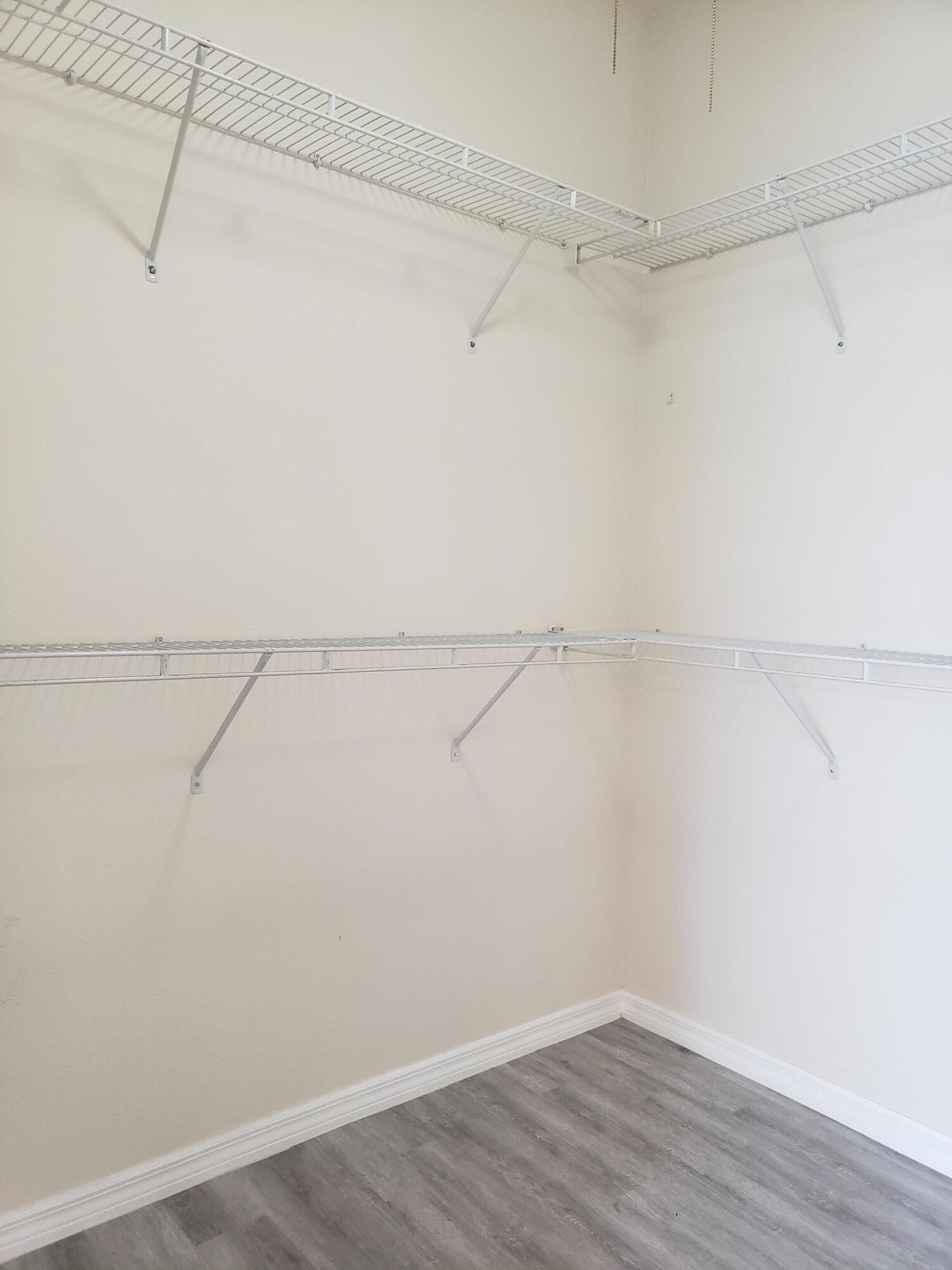 357 Southwest Coconut Key Way Port St. Lucie, FL 34986 - Photo 32 of 56 a view of a room with racks on the wall
