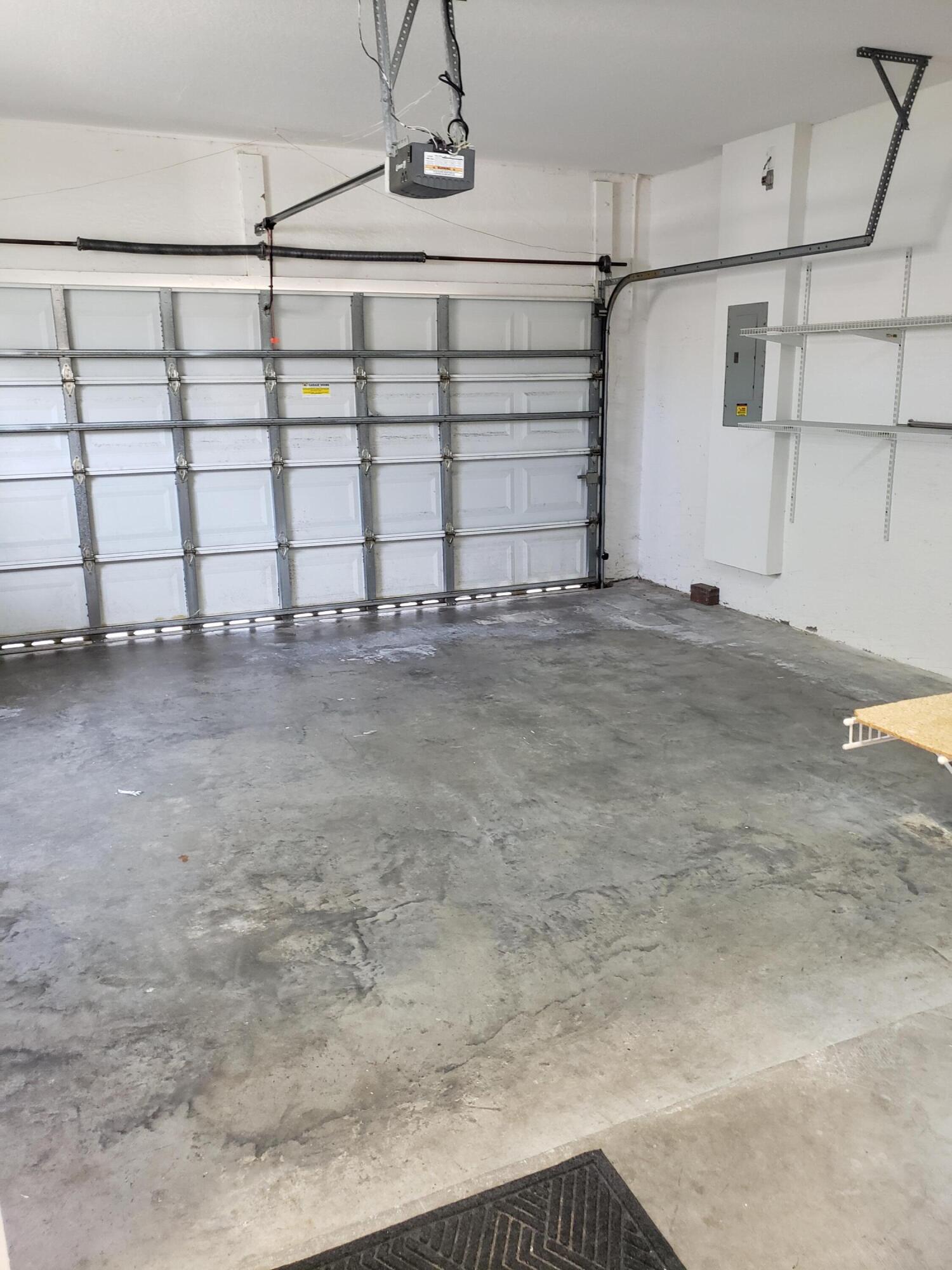 357 Southwest Coconut Key Way Port St. Lucie, FL 34986 - Photo 42 of 56 a view of a garage