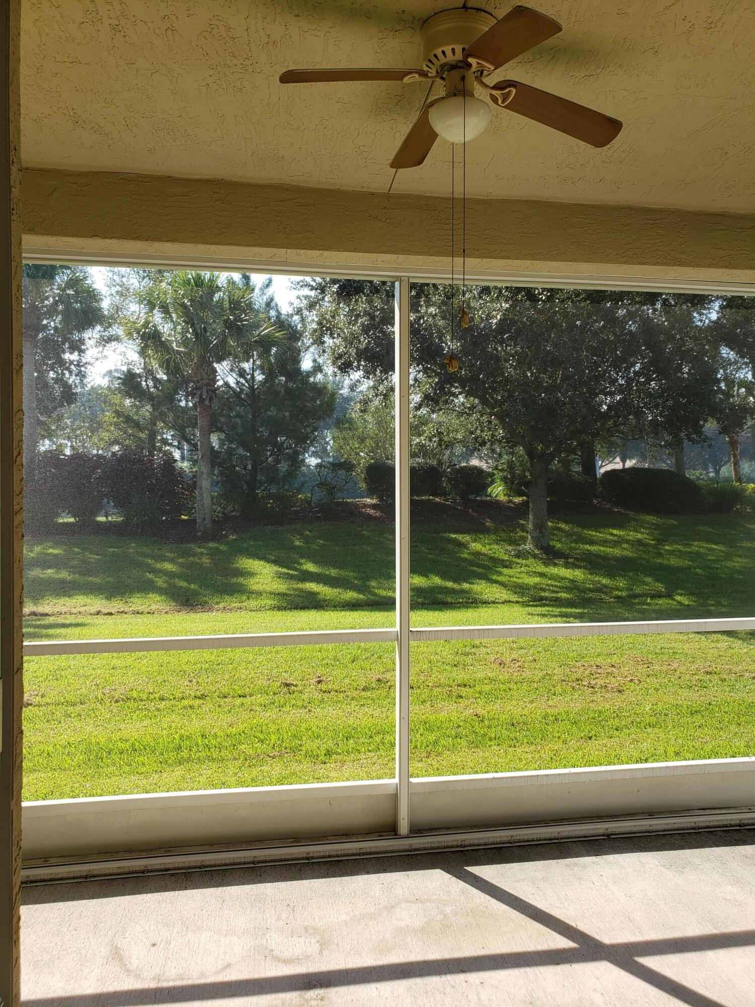 357 Southwest Coconut Key Way Port St. Lucie, FL 34986 - Photo 44 of 56 a view of a lake from a window