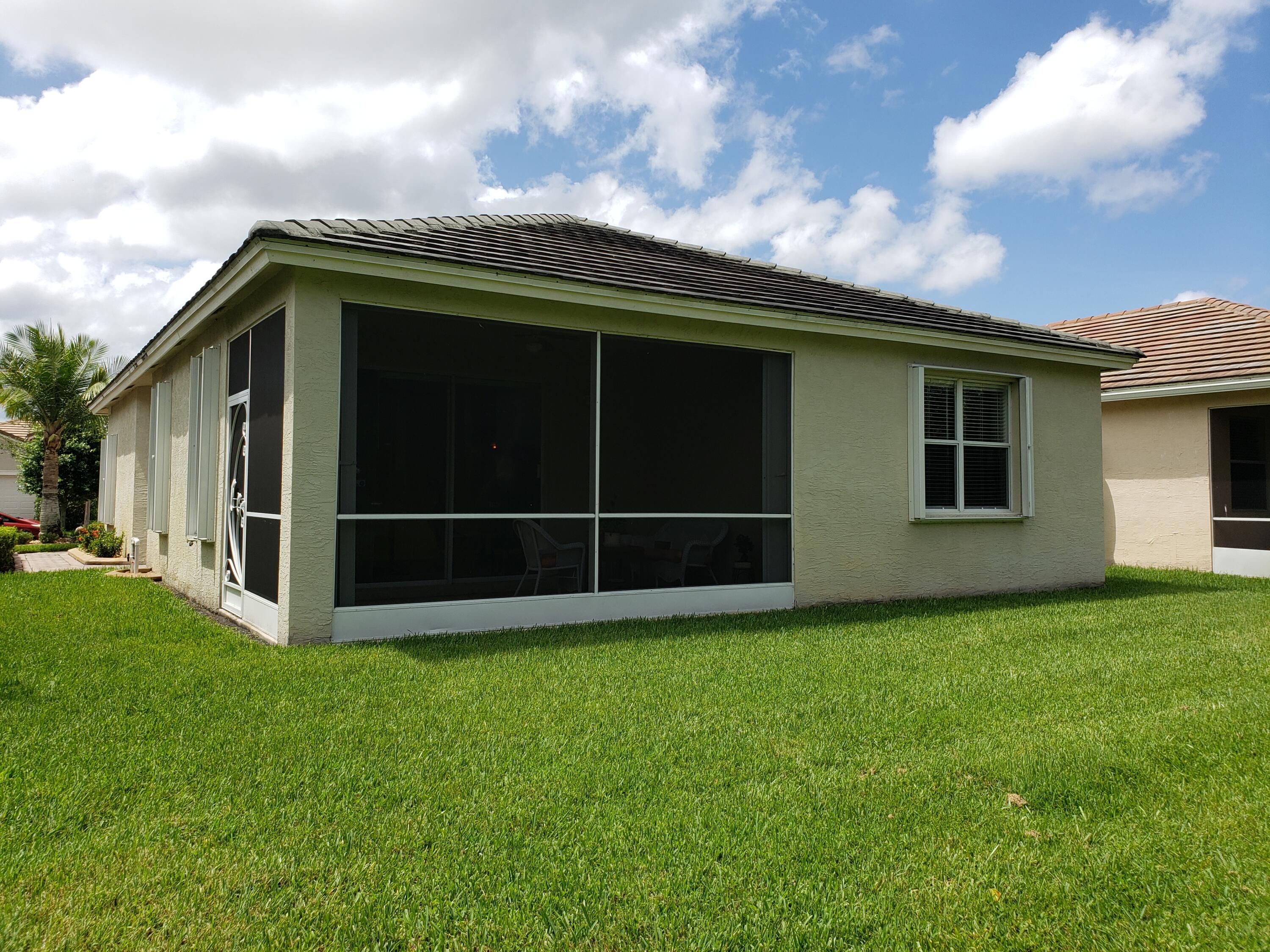 357 Southwest Coconut Key Way Port St. Lucie, FL 34986 - Photo 48 of 56 a view of backyard with hardwood and deck