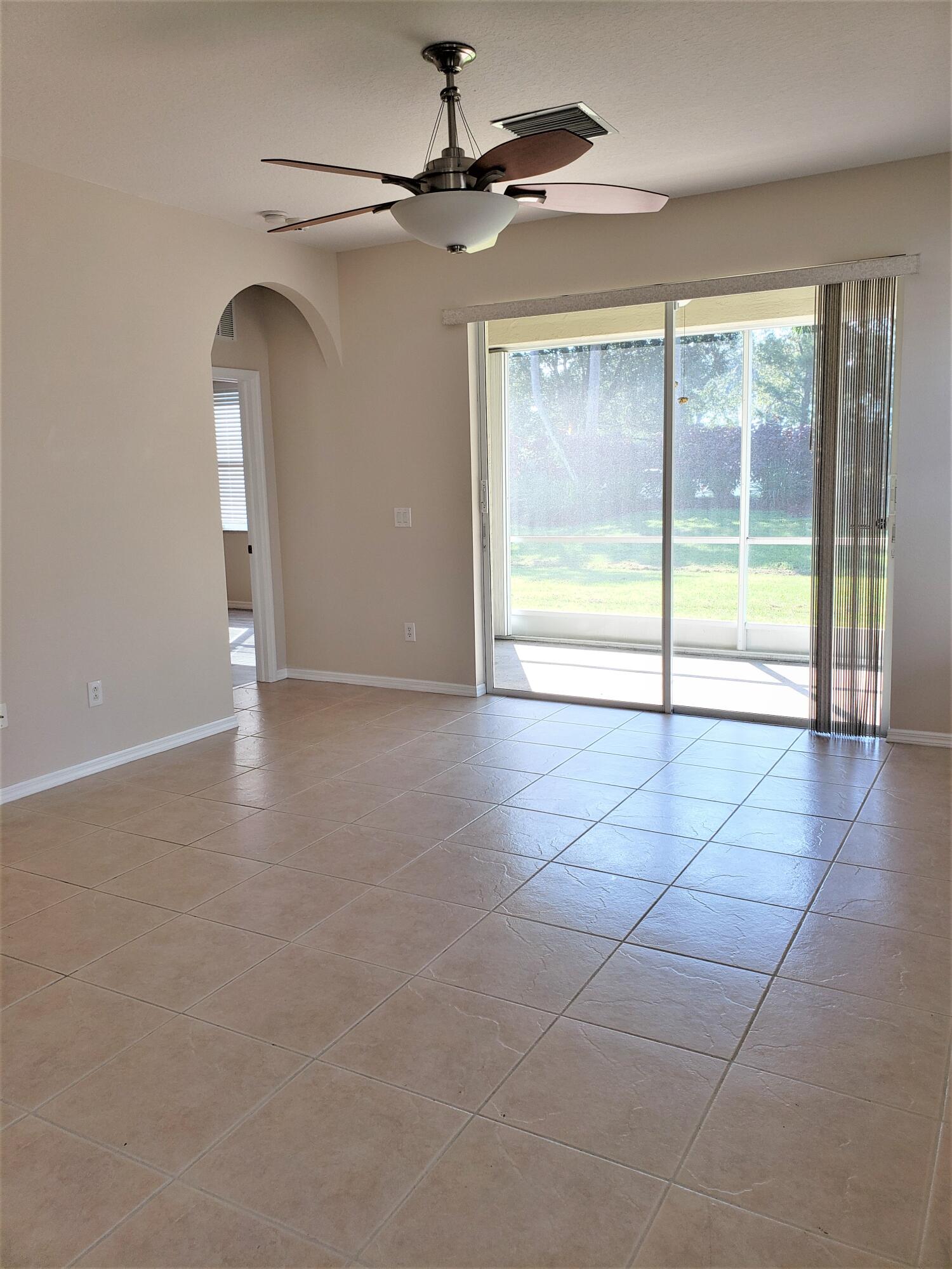 357 Southwest Coconut Key Way Port St. Lucie, FL 34986 - Photo 4 of 56 a view of an empty room with a window