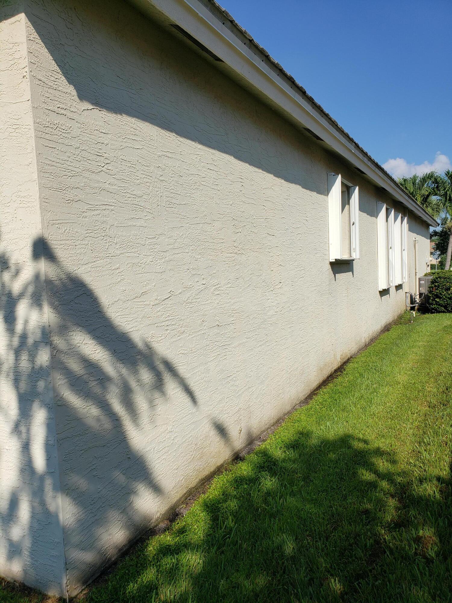 357 Southwest Coconut Key Way Port St. Lucie, FL 34986 - Photo 51 of 56 a backyard of a house with lots of green space