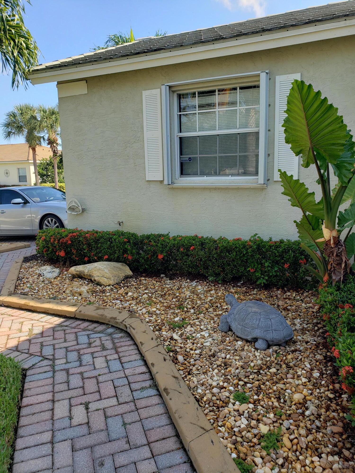 357 Southwest Coconut Key Way Port St. Lucie, FL 34986 - Photo 54 of 56 a front view of a house