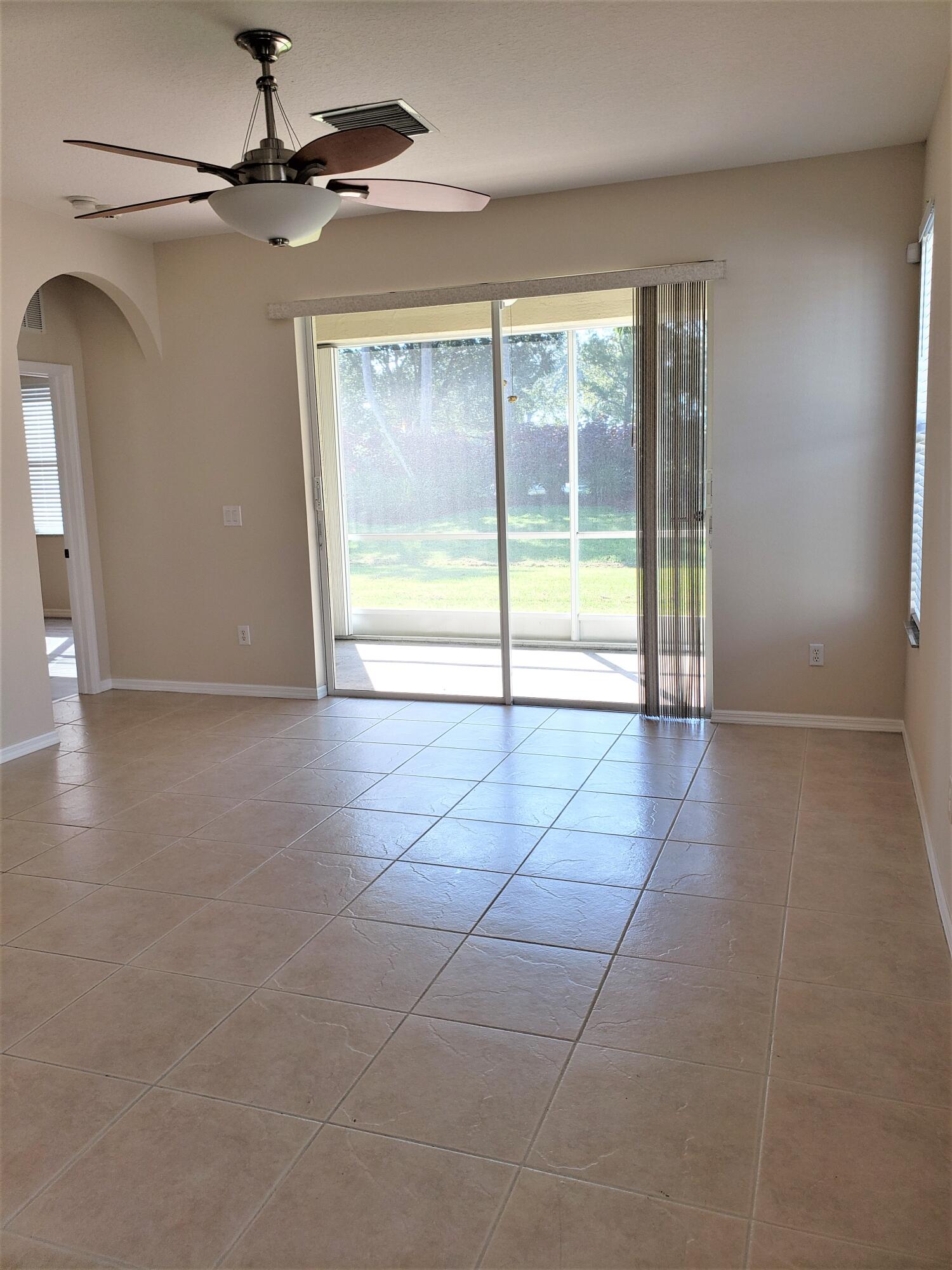 357 Southwest Coconut Key Way Port St. Lucie, FL 34986 - Photo 5 of 56 a view of an empty room with a window