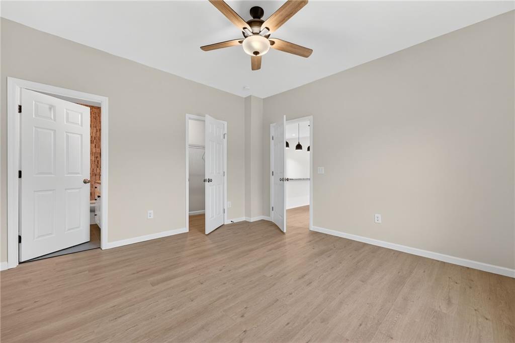43 Brownlow Drive Northwest Rome, GA 30165 - Photo 11 of 24 an empty room with closet and a ceiling fan