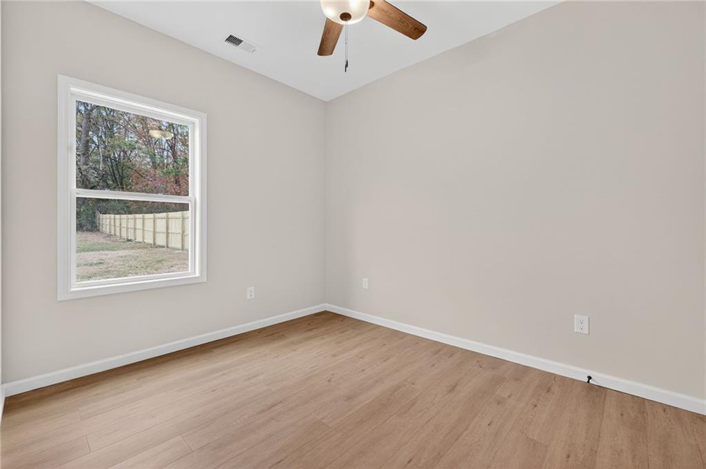 43 Brownlow Drive Northwest Rome, GA 30165 - Photo 16 of 24 an empty room with a window and a ceiling fan