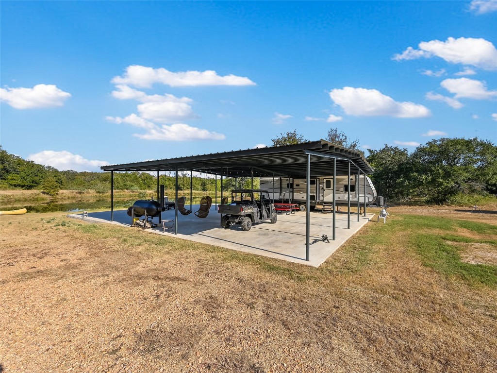 Tbd Tbd Karisch Road Giddings, TX 78942 - Photo 4 of 25 a view of swimming pool with lawn chairs and iron fence