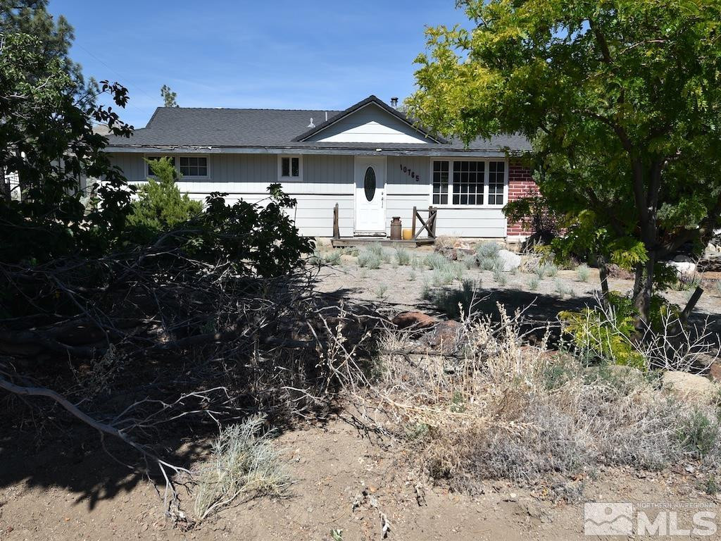 10765 Osage Road Reno, NV 89508 - Photo 1 of 22 a front view of a house with a yard