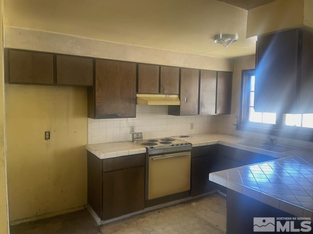 10765 Osage Road Reno, NV 89508 - Photo 15 of 22 a kitchen with a sink and cabinets