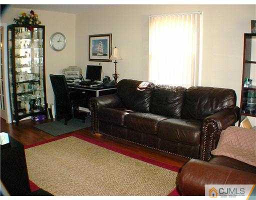 9 Stevens Road Edison, NJ 08817 - Photo 3 of 10 a living room with furniture rug and window