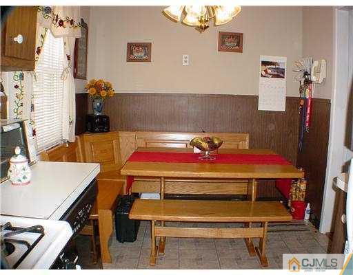 9 Stevens Road Edison, NJ 08817 - Photo 5 of 10 a room with furniture and wooden floor