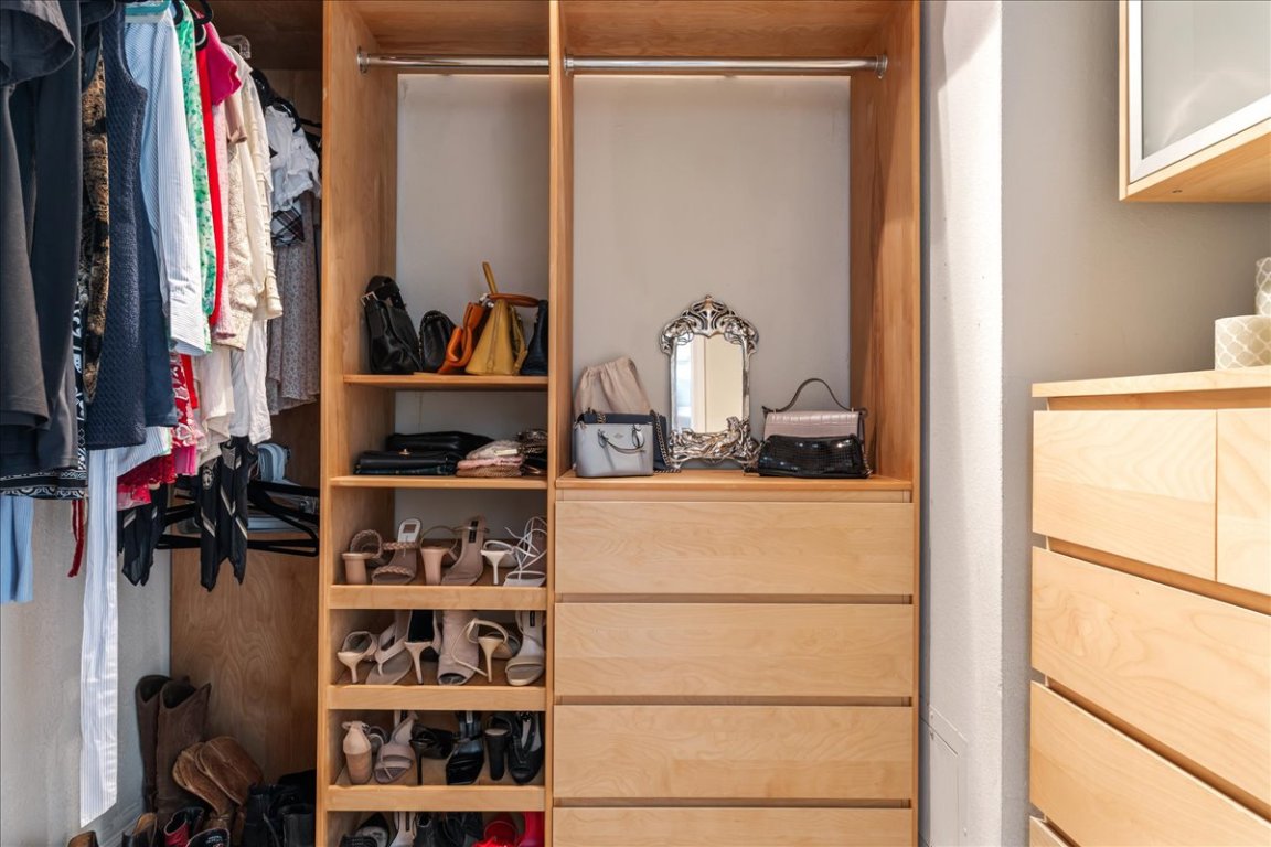 11203 Ranch Road 2222, Unit 1406 Austin, TX 78730 - Photo 13 of 37 a view of walk in closet with clothes and shoes