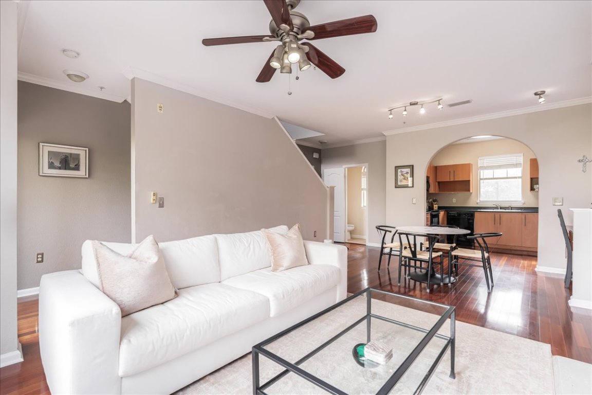 11203 Ranch Road 2222, Unit 1406 Austin, TX 78730 - Photo 19 of 37 a living room with furniture a table and wooden floor
