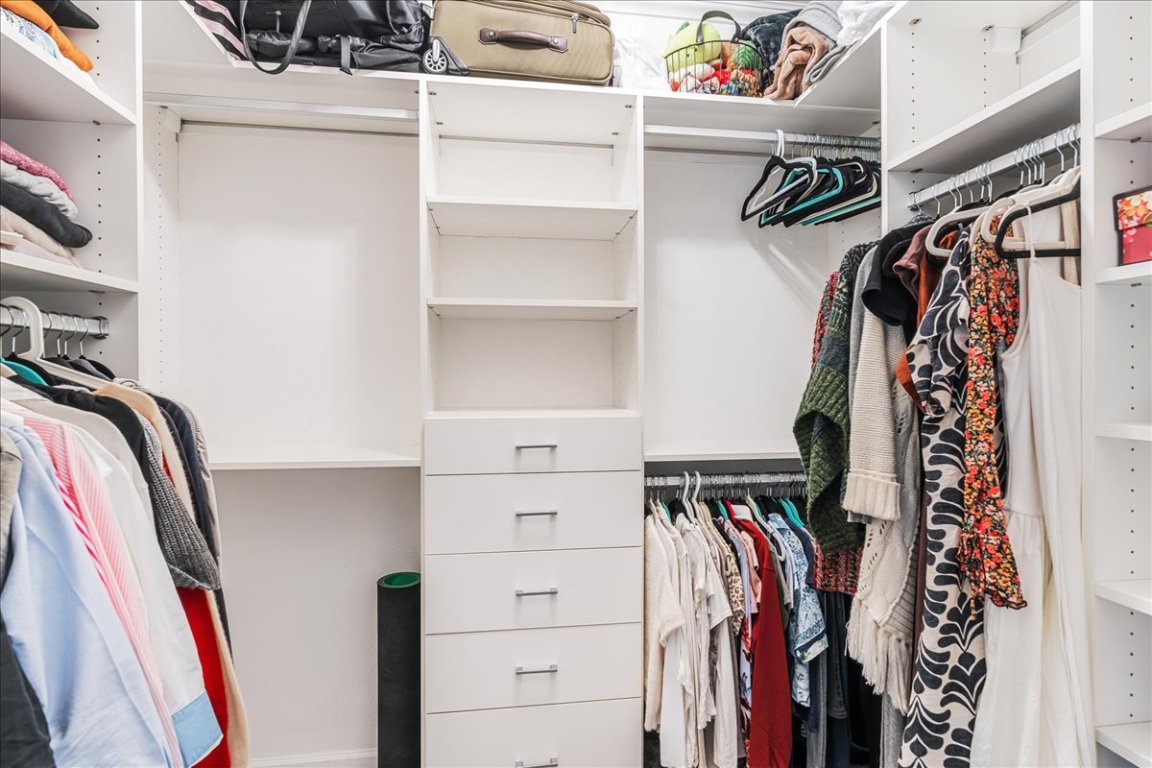 11203 Ranch Road 2222, Unit 1406 Austin, TX 78730 - Photo 30 of 37 a view of walk in closet with clothes and shoes