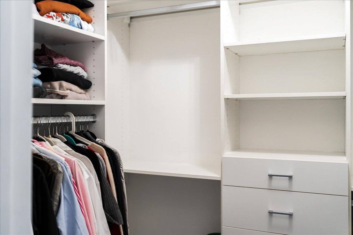 11203 Ranch Road 2222, Unit 1406 Austin, TX 78730 - Photo 31 of 37 a view of walk in closet with clothes and shoes
