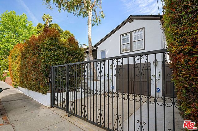 a view of a wrought iron fences in front of house