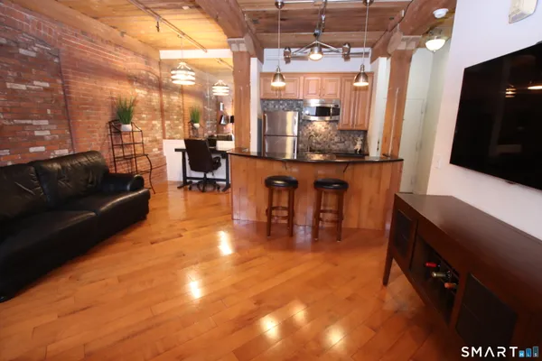 a living room with lots of furniture and a flat screen tv