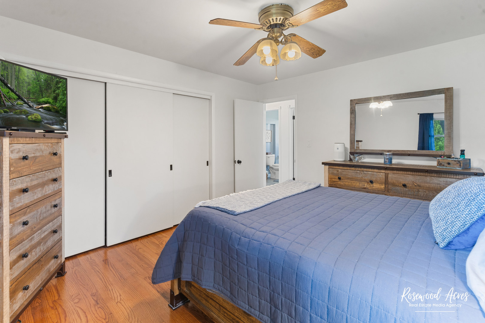 3090 River Road Kankakee, IL 60901 - Photo 11 of 22 a bedroom with a bed and a chandelier