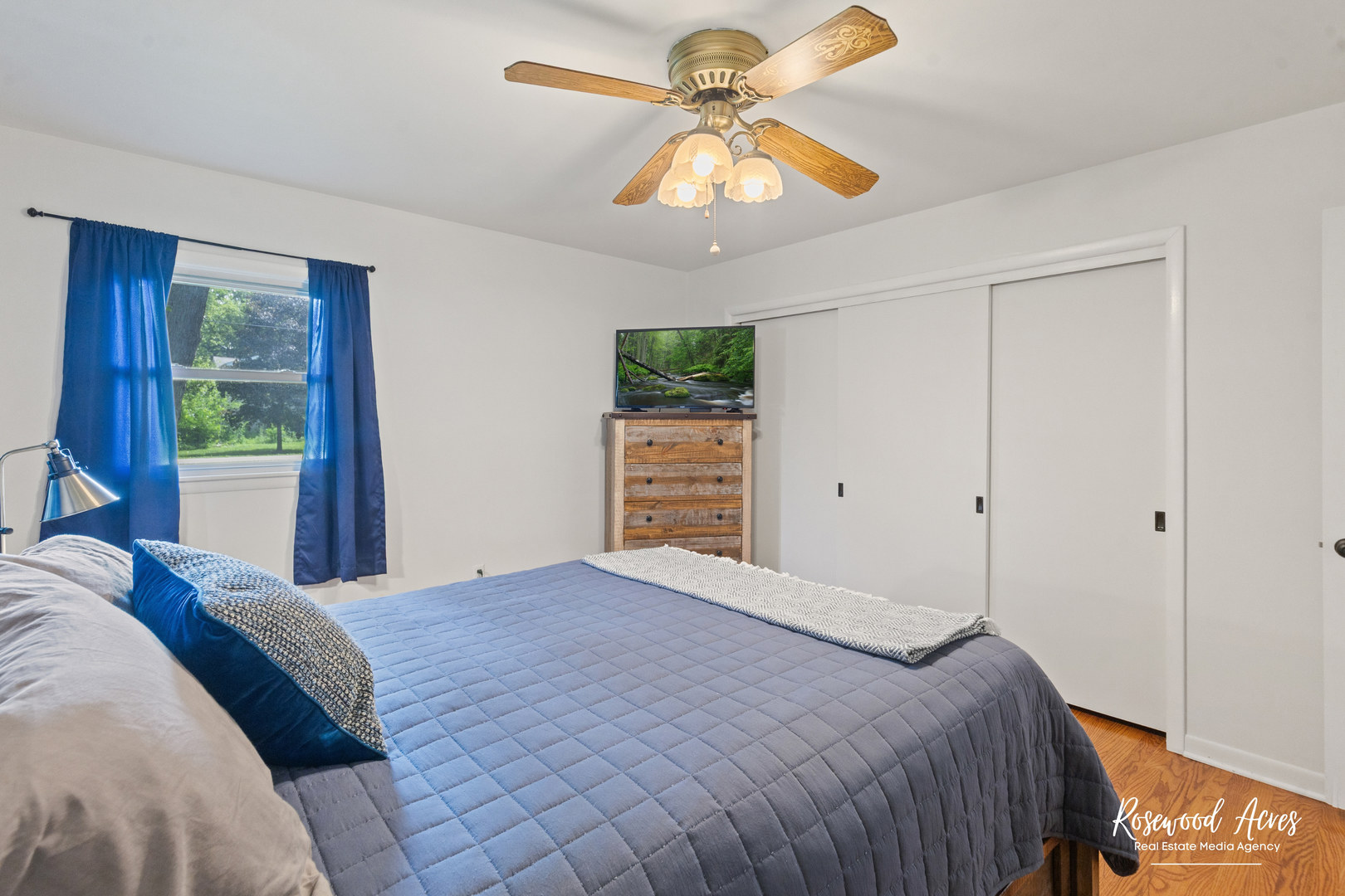 3090 River Road Kankakee, IL 60901 - Photo 12 of 22 a bedroom with a bed and a chandelier