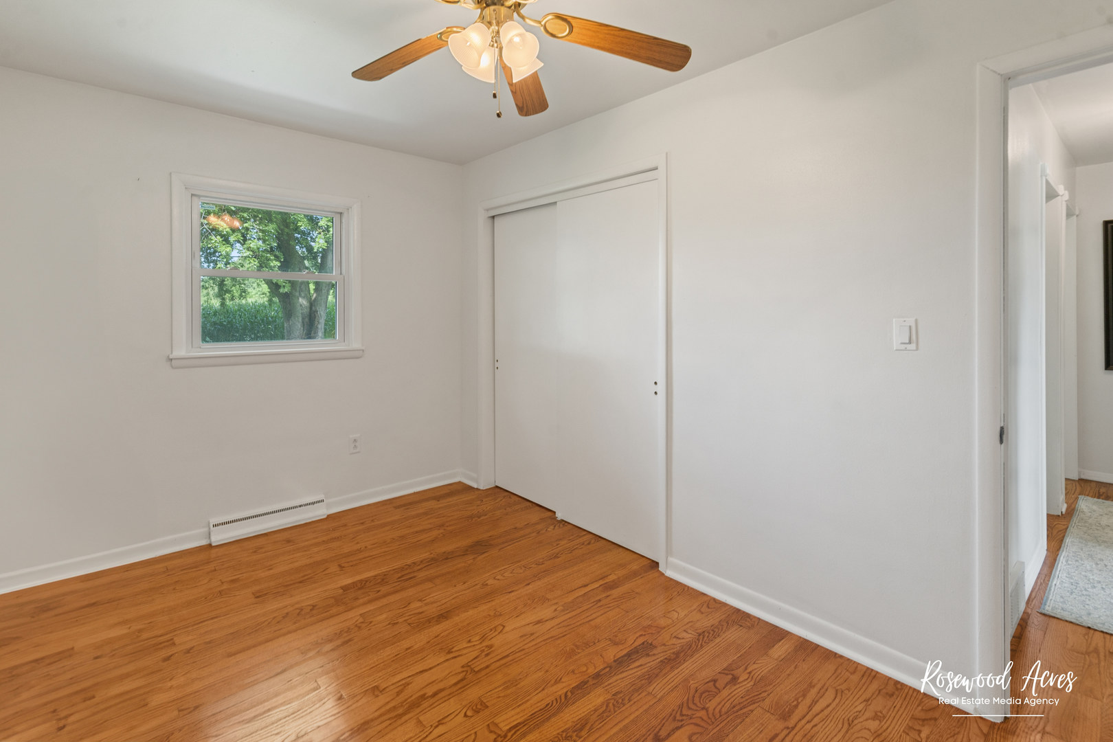 3090 River Road Kankakee, IL 60901 - Photo 17 of 22 wooden floor in an empty room with a window