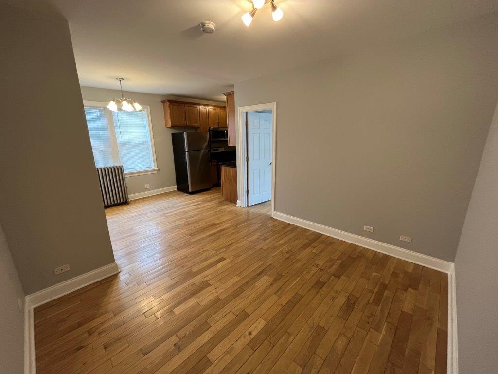 4548 West George Street, Unit 2 Chicago, IL 60641 - Photo 2 of 9 a view of a hallway with wooden floor