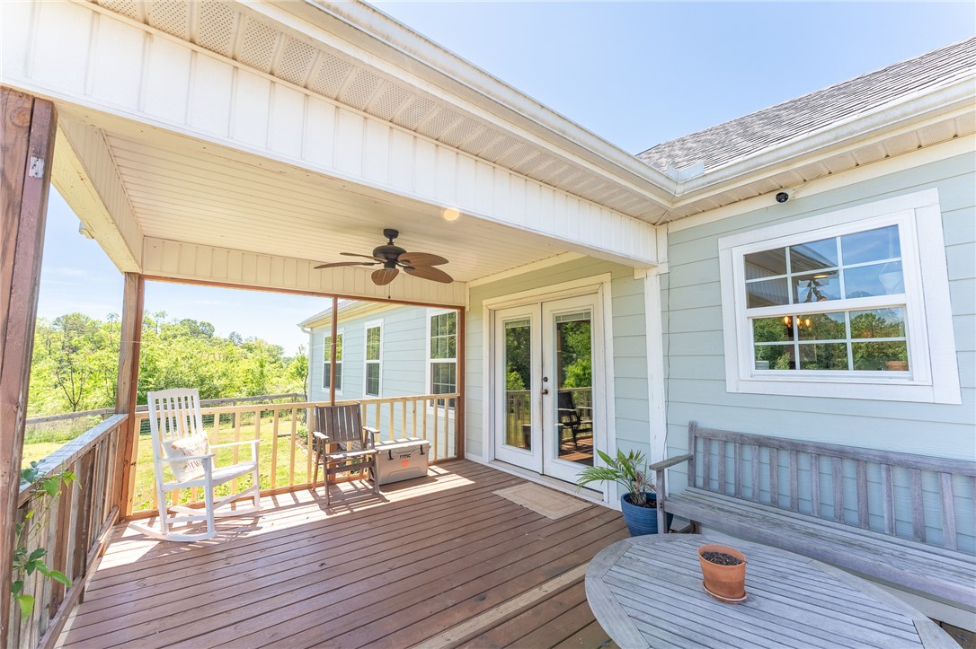 696 Mt Olivet Road Six Mile, SC 29682 - Photo 22 of 35 This inviting porch, complete with a ceiling fan, offers a seamless transition to the outdoors.