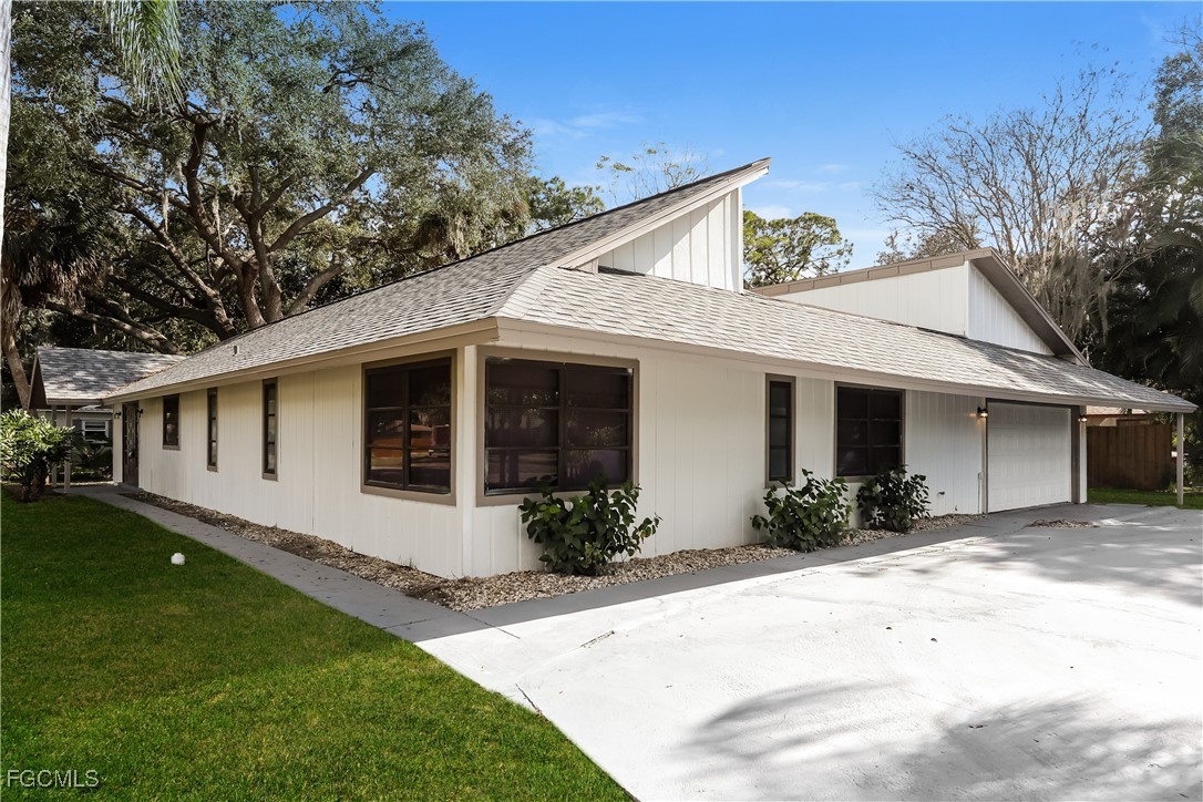1054 Mohegan Road Venice, FL 34293 - Photo 1 of 16 a front view of a house with a yard