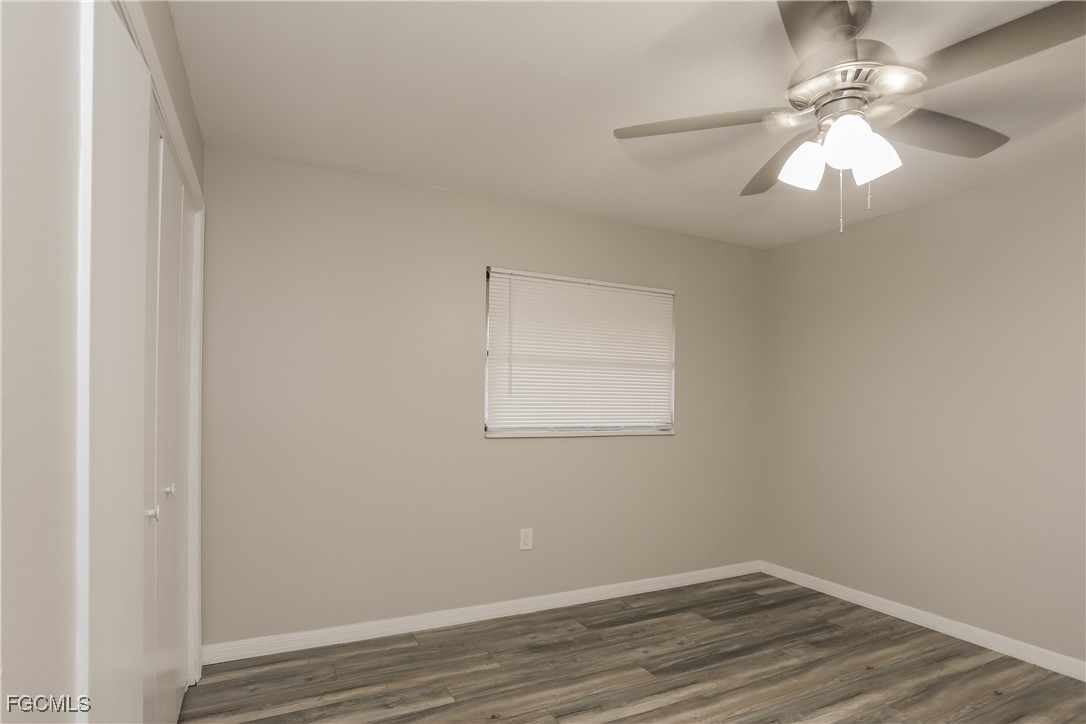 1054 Mohegan Road Venice, FL 34293 - Photo 11 of 16 wooden floor in an empty room with a window