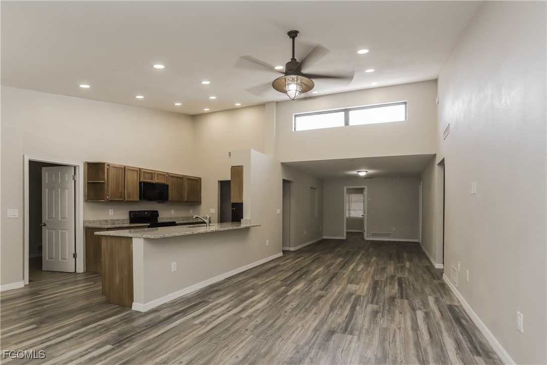 1054 Mohegan Road Venice, FL 34293 - Photo 2 of 16 a view of a kitchen with a sink and microwave