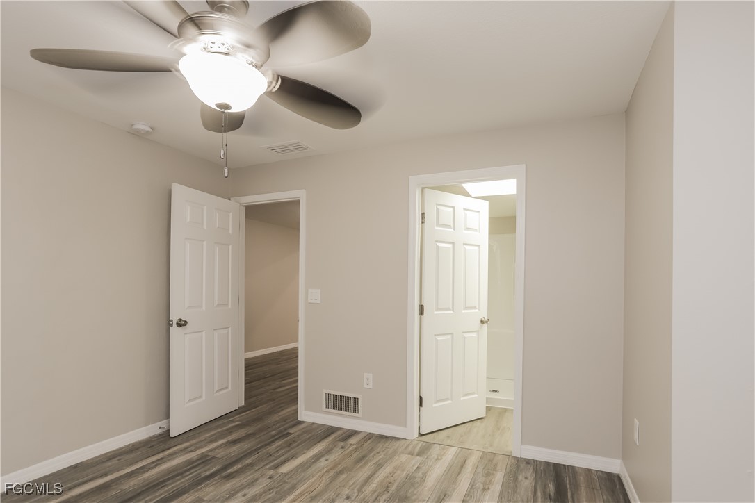 1054 Mohegan Road Venice, FL 34293 - Photo 9 of 16 wooden floor in an empty room