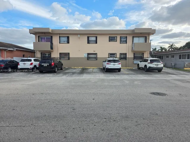 a car parked in front of a house