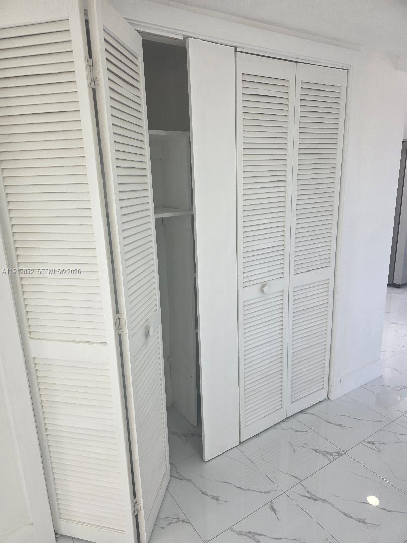 340 West 19th Street, Unit 10 Hialeah, FL 33010 - Photo 13 of 14 a view of a hallway with windows