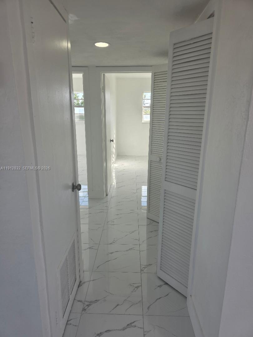 340 West 19th Street, Unit 10 Hialeah, FL 33010 - Photo 14 of 14 a bathroom with a shower and a glass door