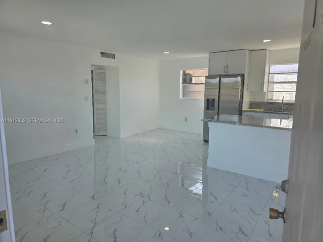 a view of a refrigerator in a room