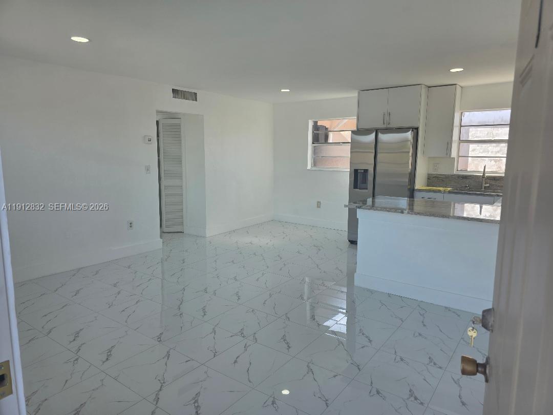 340 West 19th Street, Unit 10 Hialeah, FL 33010 - Photo 4 of 14 a view of a refrigerator in a room