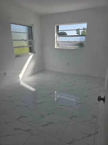 an empty room with white door
