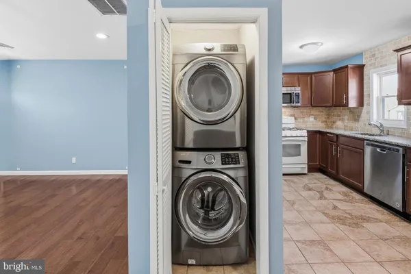 a view of a kitchen with washer and dryer