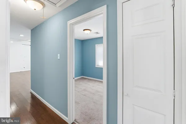 a view of a hallway with front door